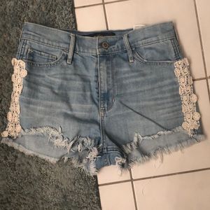 Light wash hollister shorts with lace detail